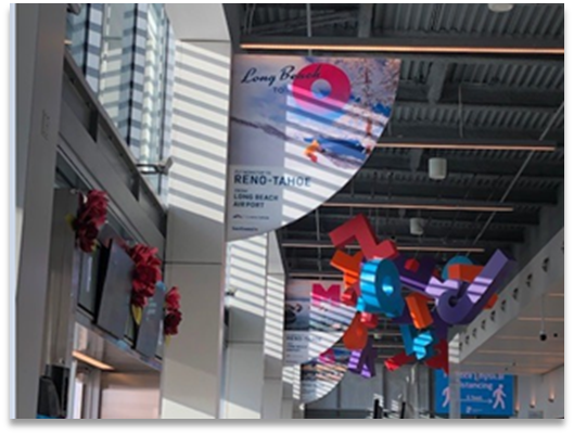 Fly Reno Tahoe hanging banners at Long Beach airport